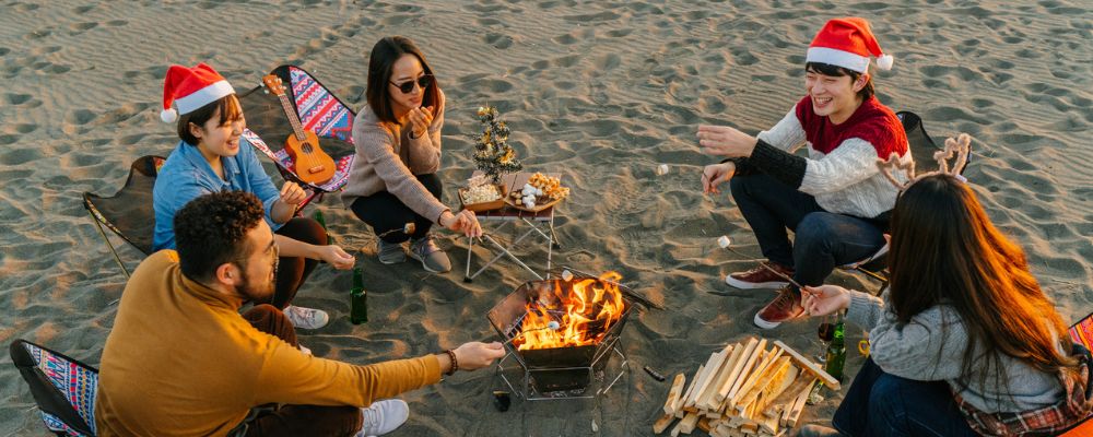 Family celebrating Christmas on the beach
